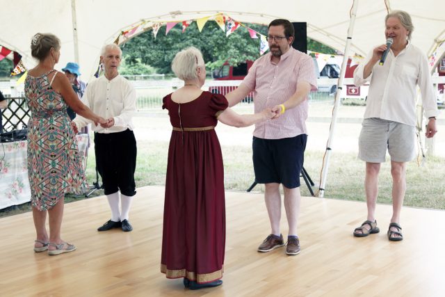 Audience participation as Mike Ruff walks two NHD dancers and two of the audience through one of the dances.