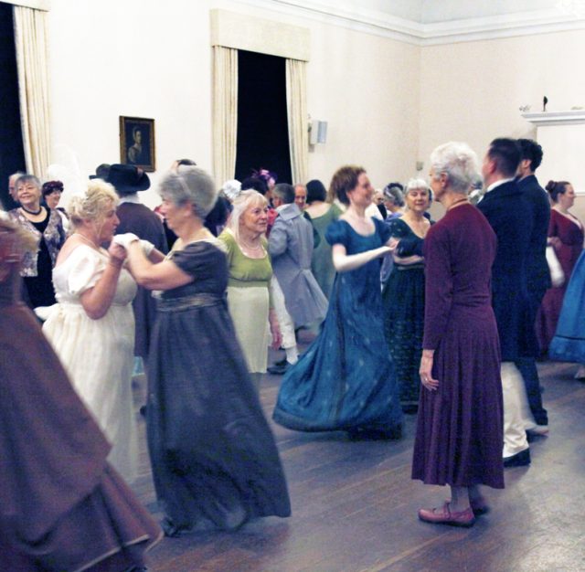 Take both hands and turn your partner during the Norwich Assembly Ball, 2025 in the Noverre Ballroom.