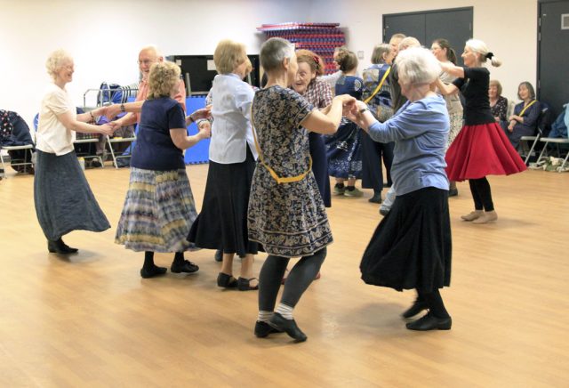 Dancing one of the 'Blossom' named dances from the French Court, performing a pousette, during the 'Allemande and Cotillion. workshop ,April 2026